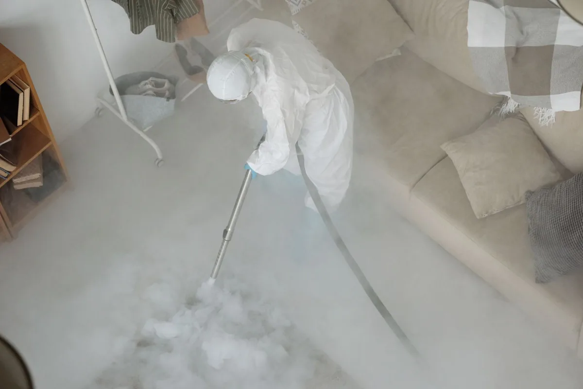 Biohazard cleanup technician in protective equipment, Woodbury, NY
